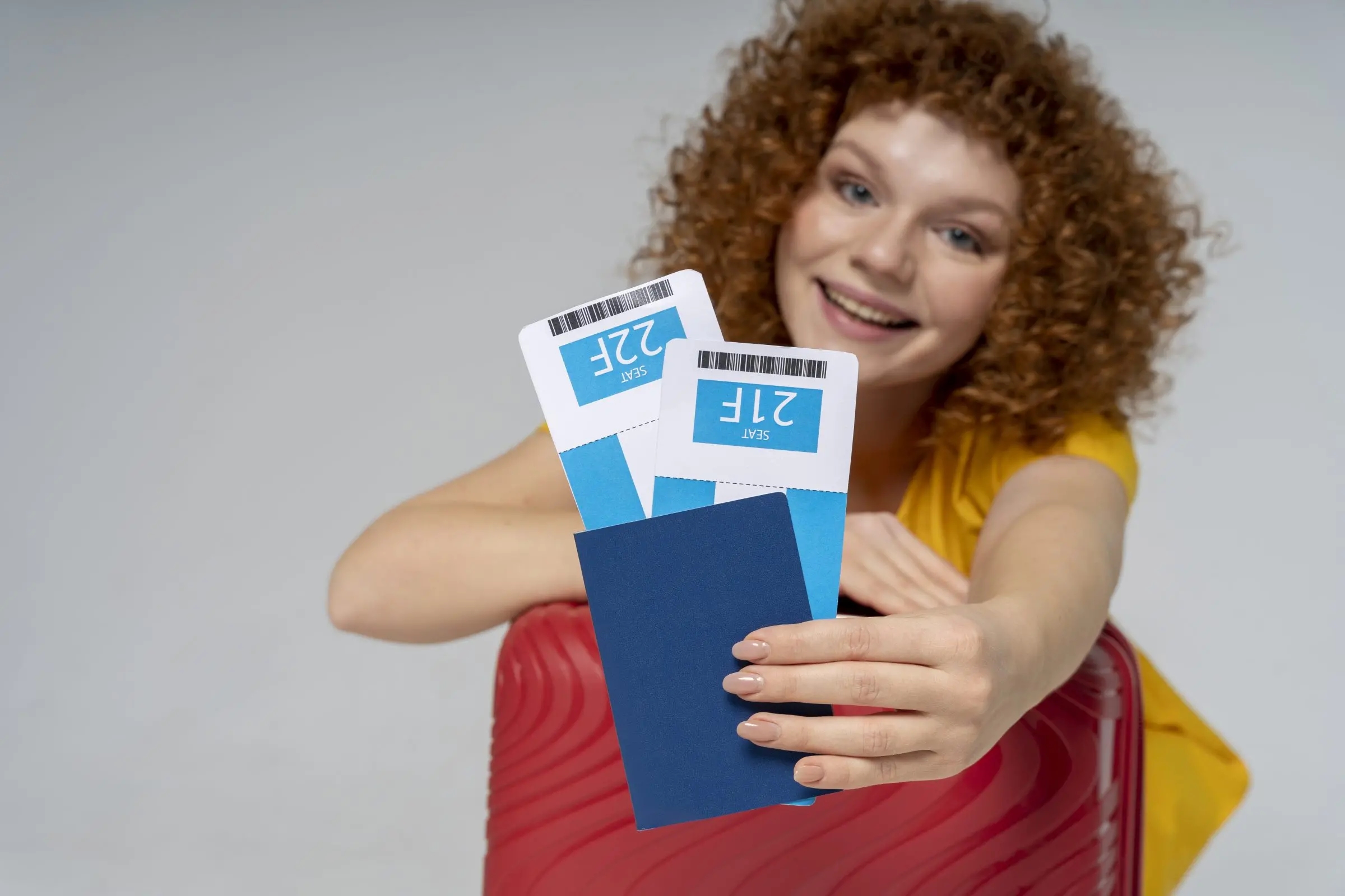 medium shot woman holding tickets