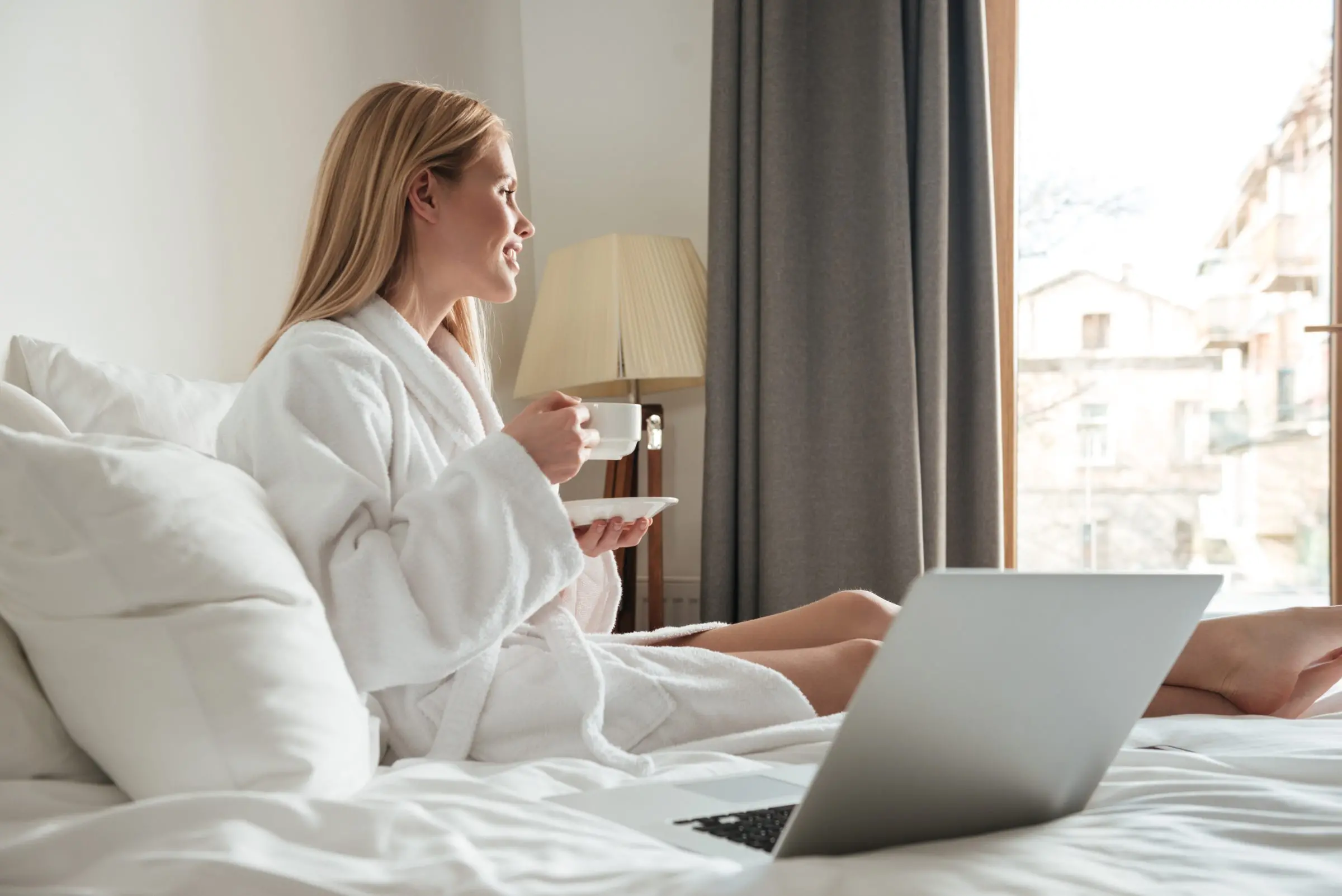 young pretty woman bathrobe drinking coffee